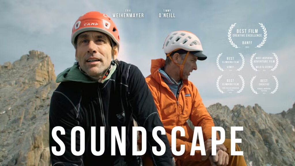 Title slide of Soundscape film showing Erik Weihenmayer and Timmy Oneil at the top of a peak with the word "Soundscape" across the bottom.